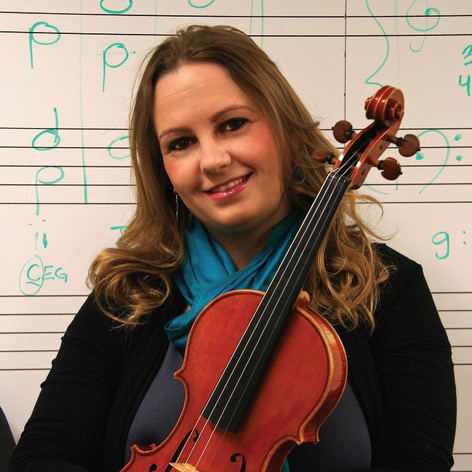 Woman posed holding a violin