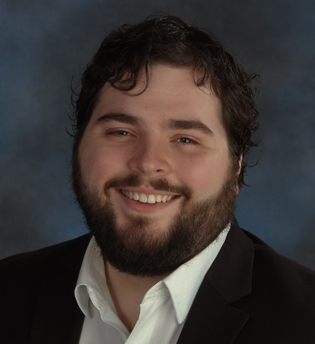 a person with a beard smiling